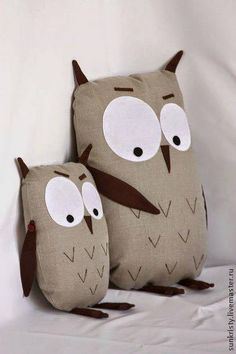 two decorative owls sitting on top of each other