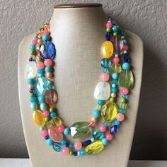 "Simply Gorgeous!! Pair this with almost any solid color top - white, blue, yellow, pink - all are equally gorgeous! Also looks perfect with a scoop neck dress. 3 strand necklace with an elegant mix of acrylic and glass beads in spring colors. 17\" Necklace with a 4\" extender chain. Silver finishing. Thank you for supporting American small and handmade business! Check out our other items: Www.PolkaDotDrawer.Etsy.com" Colorful Beaded Necklace, Pastel Jewelry, Pastel Necklace, Chunky Bead Necklaces, Geek Jewelry, Necklace Colorful, Vintage Beads Necklace, Necklace Chunky, Pearl Jewelry Necklace