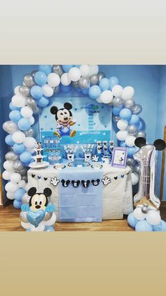 a mickey mouse party with balloons and decorations