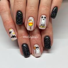 24+ Disney Halloween Nail Ideas You’ll Love For 2024 - DrExplains Cute Disney Halloween Nails, Lock Shock And Barrel Nails, Snoopy Halloween Nails, Disney Halloween Nail Art, Halloween Mickey Nails, Disney Movie Nails, Halloween Disney Nails