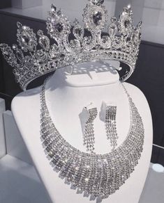 a tiara and earrings on display at a jewelry store