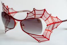 Boz Scandale Spider Web sunglasses in red color decorated with red and silver stones. This model has been discontinued by the manufacturer and is very rare now.  Boz Scandale 3333 52◻18 121 Patented design Made in France 100% Authentic Condition: Very good pre-owned condition. No signs of wear, no scratches on the lenses. There is just one very little chipped place on the right lens. Please carefully check the last photo. I made it with macro camera. It can't be easily noticed and you can't feel it when you wear the glasses.  Dimensions:  Overall Width: 138 mm = 5.43 in  Lens Width: 52 mm = 2.05 in Lens Height: 34 mm = 1.34 in Temple Length: 121 mm = 4.76 in Nose Bridge: 18 mm = 0.71 in The glasses will be sent in their original glasses case (however it's peeled off because of time) with a Luxury Red Sunglasses For Party, Luxury Red Sunglasses For Formal Occasions, Elegant Red Sunglasses For Formal Occasions, Red Sunglasses For Summer Formal Events, Red Sunglasses For Formal Summer Events, Formal Red Sunglasses For Summer, Spider Sunglasses, Decorated Sunglasses, Glasses Inspo