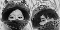 two women wearing helmets are posing for the camera