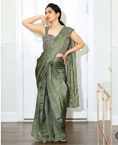 Ready-to-Wear One-Min Saree in Olive Green Description: Step into elegance effortlessly with this stunning ready-to-wear saree in an exquisite olive green shade. This one-minute saree is designed to give you a sophisticated look in no time, featuring intricate detailing and a flattering fit. Perfect for any occasion, this saree combines traditional charm with modern convenience. Details: Color: Olive Green Style: Ready-to-Wear One-Min Saree Size: 40 Blouse: Included Fabric: Premium Organza Work: Elegant Pre-draped Saree In Pista Green For Festive Occasions, Elegant Pista Green Pre-draped Saree For Festive Occasions, Elegant Festive Pre-draped Saree In Pista Green, Elegant Pista Green Pre-draped Festive Saree, Fitted Green Pre-draped Saree With Self Design, Fitted Green Self-design Pre-draped Saree, Elegant Pista Green Blouse With Traditional Drape, Elegant Pista Green Pre-draped Saree With Cutdana, Elegant Pista Green Saree For Reception