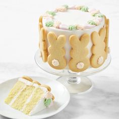 there is a cake with bunny ears on it and a piece of cake next to it