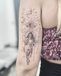 a woman's arm with a tattoo on it and an image of a clock