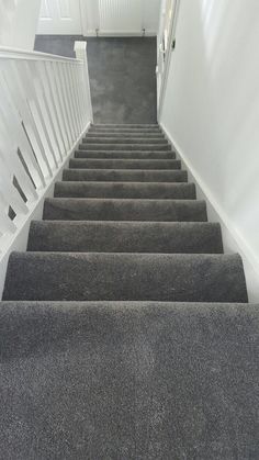 a set of stairs leading up to a white door