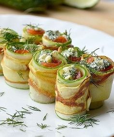 small appetizers are arranged on a white plate