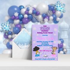 a purple and white birthday party with balloons, snowflakes and an envelope for the family