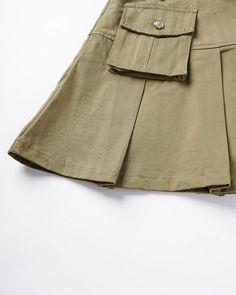 Details: Cargo pleated skirt with belt and pockets designSkirt Length: ShortMaterials:95% Polyester + 5% Spandex Green Fitted Tennis Skirt With Pockets, Fitted Green Tennis Skirt With Pockets, Summer Skirted Skort With Pockets, Khaki Knee-length Skirt With Pockets, Solid School Skirt With Pockets, Casual Pleated Skirt With Belt Loops For Work, Casual Belted Mini Skirt, Casual Belted Mini Skort, Solid Color Mini Skort With Pockets