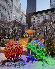 christmas lights in the shape of balls on display at rockefeller's garden, new york city