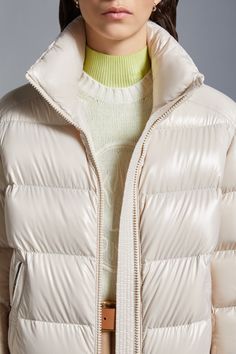 The Maire is an iconic Moncler womenswear piece. This down jacket features comfortable lines and is crafted in resistant nylon laqué. The short puffer jacket showcases a timeless design with a detachable hood and high-performance elements that guarantee comfort and warmth. Beige Nylon Puffer Jacket With Padded Collar, Luxury Nylon Puffer Outerwear, Short Puffer Jacket, Jacket Beige, Down Jackets, Quiet Luxury, Detachable Hood, Puffer Jacket, Down Jacket