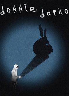 the shadow of a person holding a knife in front of a rabbit's head