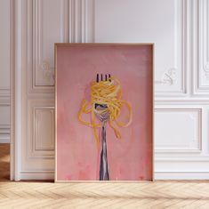 a painting with spaghetti on it hanging in front of a white wall and wooden floor