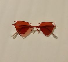 Vintage red triangle sunglasses with red trim Triangle Sunglasses, Red Triangle, Tinted Glasses, Beaufort Sc, Eyewear Sunglasses, Rocket, Sunglasses Accessories, Trim, Sunglasses