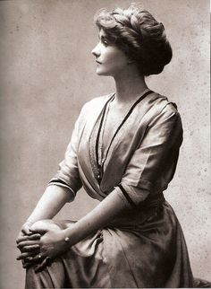 an old black and white photo of a woman