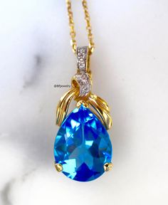 Metal: 14kt Yellow Gold Stone: Diamond And Swiss Blue Topaz Stone Shape: Round And Pear-Shape Swiss Blue Topaz Weight: 9.36 ctw Diamond Weight: .36 ctw Weight of entire piece with chain: 6.60 grams Type of Lock: Lobster Clasp Type of Bail: Enhancer (This is great for clipping the pendant onto wide chains. Length Of Pendant From Top To Bottom: 28 mm Type of chain: 14kt Yellow Gold 1.2mm Diamond Cut Role Chain Length of chain: 16 Inch Note: Other chains available, or you can purchase the pendant w Amethyst And Diamond Ring, Blue Topaz Stone, Gold Stone, Swiss Blue Topaz, Topaz Stone, Matching Band, Heart Design, Blue Topaz, Pendant Necklaces