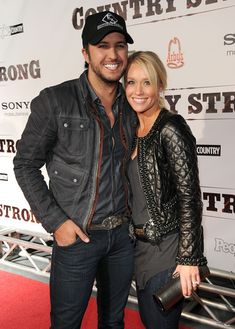 a man and woman posing on the red carpet at an event for country strong tv