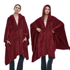 two women in red robes with hoods on and one is wearing black jeans, the other has a white t - shirt