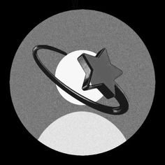 a black and white photo of a ring with a star on it