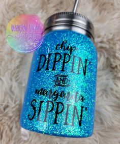 a blue glittered canister with the words dippin and magic's spin on it