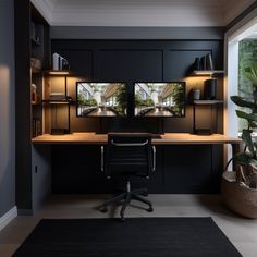 an office with black cabinets and two large windows