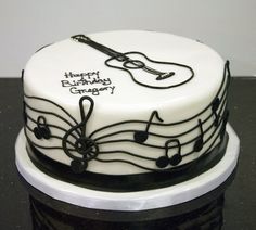 a birthday cake decorated with musical notes