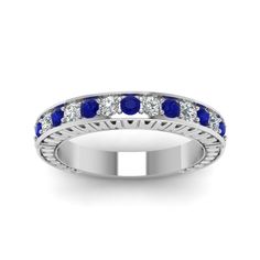 a white gold ring with blue sapphire stones