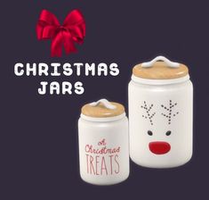 two christmas jars with reindeer faces painted on them, one is white and the other is red