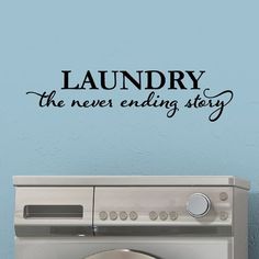 laundry the never - ending story wall decal on a blue wall above a washer