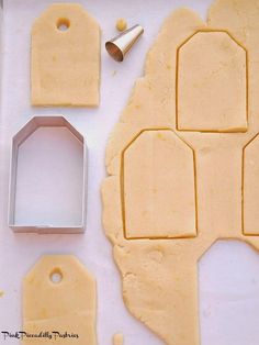 the cookie cutters are being used to cut out shapes for the gingerbread cookies