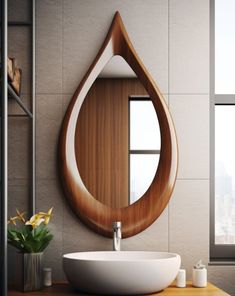 a bathroom with a sink, mirror and vase on the counter in front of it