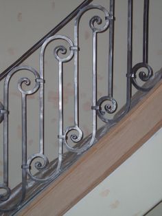 a close up of a metal hand rail on a stair case