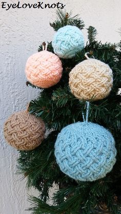 crocheted ornaments are hanging from a christmas tree