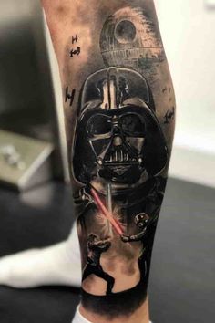 a man's leg with a star wars tattoo on it and a darth vader