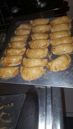 there are many pastries that are on the baking sheet and ready to go into the oven