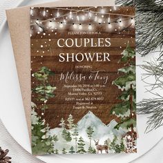 the couple's shower is decorated with pine trees and lights