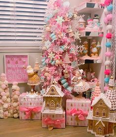 a pink christmas tree with lots of decorations