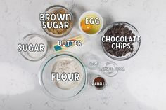 ingredients to make chocolate chip cookies laid out on a white counter top with the words, brown sugar, butter, flour, cocoa