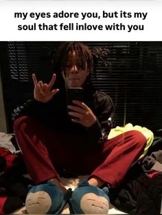 a man sitting on top of a bed holding a cell phone in his hand and the caption reads, my eyes adore you, but its my soul that fell in love with you