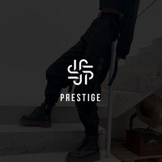 a man standing on some steps with his feet up and the words prestige written in white