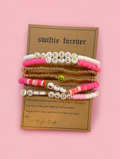 Gift your favorite Swiftie some bracelet love! 5 pink and gold bracelets to wear and share <3 Adjustable Pink Gold Bracelet For Valentine's Day, Pink Stackable Charm Bracelet As Gift, Pink Name Bracelet For Friendship On Valentine's Day, Cute Pink Bangle Charm Bracelet, Trendy Adjustable Pink Gold Jewelry, Valentine's Day Pink Name Bracelet With Letter Beads, Personalized Pink Bracelets For Everyday, Personalized Pink Bracelets For Everyday Wear, Adjustable Pink Charm Bracelet For Everyday