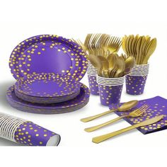 a purple and gold table setting with napkins, cups, forks and spoons