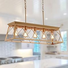 a chandelier hanging from the ceiling in a kitchen