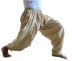 Dhoti made easy, in the form of Trousers.Made from 4 meter cotton fabric.These are fully flexible; you can stretch your legs as much as you can.Whether it is Bhujangashan, Halasan, or Shirshashan, you won't find your trousers/dhoti stopping you.Our search for best yoga trouser design ended here. ----------- Sizes: M:For below 5 Feet 6 Inches Tall L: For above 5 Feet 6 Inches Tall  ------ Designed For Costume:Indian or Punjabi Dress,Party,Costume Yoga and Meditation: Very flexible for professional Yoga Practices and Professional Dances ---- Our customers are professional yoga teachers, International dance groups and obviously common people who would like to dress up in Indian costume/Attire  ------ ✔Designed for Padmasan to Shirshashan( where splits are required) ✔Simultaneously elasticated Beige Cotton Yoga Bottoms, Traditional Harem Pants For Meditation, Traditional Cotton Pants For Festivals, Traditional Relaxed Fit Harem Pants For Yoga, Traditional Cotton Harem Pants For Navratri, Traditional Cotton Harem Pants, Traditional Relaxed Fit Harem Pants, Traditional Cotton Bottoms For Meditation, Traditional Cotton Pants With Drape