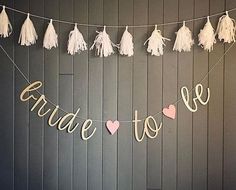 some tassels are hanging from a string with the words, bride to be