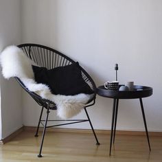 a chair and table in a small room