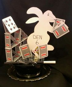 a rabbit with playing cards on top of it