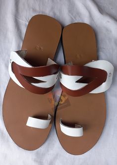 Beautifully designed African Leather sandals, Masai sandals, summer sandals, African sandals Made from leather Available in all sizes. Kindly, using the chart provided in the pictures above, check your foot size in EUR and US sizes before placing your order. Wholesale is available upon request at a discount price. Shipping is via DHL EXPRESS with a GUARANTEED delivery between 3-5 days worldwide. **BUY MULTIPLE ITEMS, PAY SHIPPING ONCE** FREE SHIPPING FOR ALL ADDITIONAL ITEMS IN YOUR CART Check o Leather Flip Flops For Beach Season, Leather Flip Flops For Beach, Leather Flip Flops For The Beach, Leather Sandals With Single Toe Strap For Beach Season, Brown Slip-on T-strap Sandals For Vacation, Leather Flat Flip Flops For Beach Season, Brown Single Toe Strap Flip Flops For Beach Season, Leather Summer Flip Flops With Open Toe, White Leather Toe Post Sandals