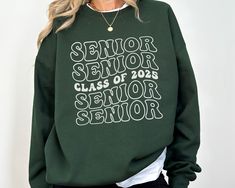 ORDER BY DECEMBER 10TH TO ENSURE CHRISTMAS DELIVERY.  ORDERS WILL STILL BE ACCEPTED AFTER THIS DATE, AND WILL BE PROCESSED AS SOON AS POSSIBLE, BUT MAY NOT ARRIVE BEFORE CHRISTMAS DAY.  PLEASE PLAN ACCORDINGLY AS REFUNDS WILL NOT BE PROVIDED FOR ORDERS THAT ARE DELIVERED WITHIN THIER ESTIMATED WINDOW.   This SENIOR CLASS OF 2025 Gildan 18000 sweatshirt is the perfect way to celebrate this school year.  The retro vibe of this design gives this 2025 grad sweater a vintage look that is trendy and s Senior Class Sweatshirts, Senior Year Clothes, Senior Hoodies Design Ideas 2025, Seniors Hoodies, Senior Sweaters, Senior Sweatshirts Ideas, Senior Sweater, Senior Hoodies Design Ideas, Seniors 2025